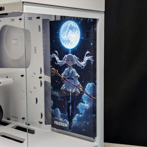 May include: A computer case with a custom panel featuring an anime illustration. The artwork depicts a character with white hair, holding a staff, set against a backdrop of a full moon and starry night sky. The word "FRIEREN" is visible.