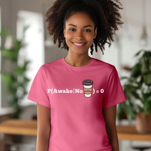 May include: Pink t-shirt with a white graphic of a coffee cup and the text "P(Awake|No Coffee) = 0".