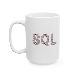 May include: White ceramic mug with a red outline of the word "SQL" in black and white newspaper print.