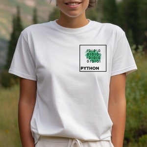 May include: White t-shirt with a green and black graphic design that says "PYTHON" and a grid of 1s and 0s.