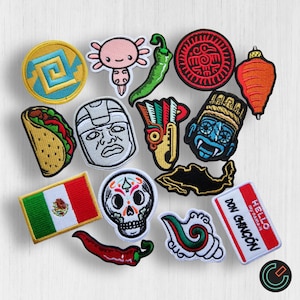 May include: A set of 14 colourful embroidered iron-on patches featuring Mexican cultural themes. The patches include a taco, a skull, a chilli pepper, an axolotl, a map of Mexico, a traditional mask, and more.