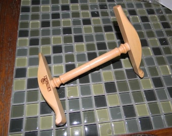 May include: A wooden yarn swift with a curved design and the word "Kromski" engraved on the side.