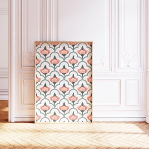 May include: A framed print featuring a repeating pattern of pink flowers and green leaves on a white background.