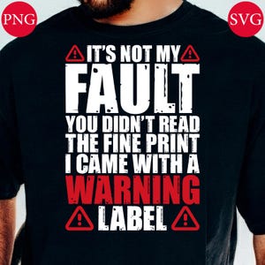 May include: Black t-shirt with the text "IT'S NOT MY FAULT YOU DIDN'T READ THE FINE PRINT I CAME WITH A WARNING LABEL" in white and red. The design includes warning symbols.