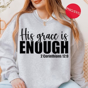 May include: A light gray sweatshirt with the text "His grace is ENOUGH" in black script and block letters, with "2 Corinthians 12:9" below. A red circle with "PNG/SVG" is in the upper right corner.