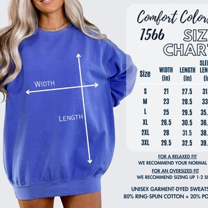 May include: Size chart for a unisex sweatshirt in various sizes, with measurements in inches for width, length, and sleeve length. The chart includes sizes S, M, L, XL, 2XL, and 3XL. The sweatshirt is made of 80% ring-spun cotton and 20% polyester.
