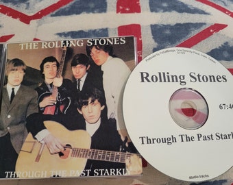 Le CD des Rolling Stones Through the Past Import très prononcé. Trident acétates. Sorties en édition limitée.