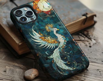 May include: A smartphone case featuring a stained-glass phoenix design in teal, gold, and white. The case has a black border and a detailed illustration of the mythical bird with outstretched wings. The background is a mosaic pattern.