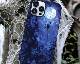 May include: A blue and black phone case with a spider web design and a moon. The case has a spider in the center of the web and a moon in the upper right corner. The case is made of a hard plastic material.