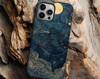 May include: A dark blue smartphone case featuring a celestial design with a golden moon, intricate star constellations, and stylized clouds. The artwork includes thin gold lines connecting stars against a deep navy background with a smooth finish.