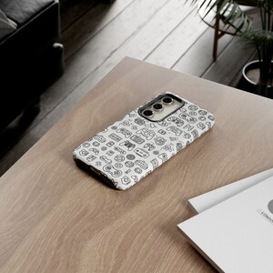 a cell phone sitting on top of a wooden table