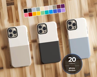 May include: Three smartphone cases featuring a two-tone design with a white upper section and a solid colored lower section in beige, dark gray, and light blue. A color palette chart displays 20 options, and a circular badge reads 20 colors glossy version.