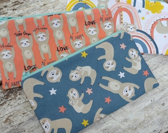 Sloth zipper pouch. Pencil bag. Mama and baby sloths. Fully lined fabric bay. Three different designs. Rainbows and stars