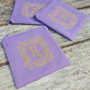 The one with the monogram zipper pouch. Gift idea. Friends door. Monica, Rachel, Phoebe.