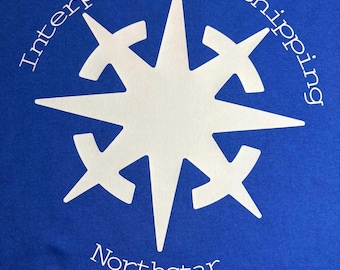 May include: Royal blue t-shirt with a white starburst design. The words "Interplanetary shipping" are arched above the starburst, and "Northstar" is below. The design is centered on the shirt.