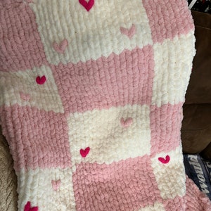 Beautiful finger knitted chunky chenille blanket. Checkered with hearts xx