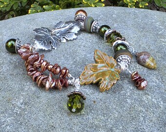 Gilded Forest, Beaded Bracelet, Lampwork beads, Ceramic Leaf, ceramic Acorn, Fall, Autumn Bracelet, green, brown, nature freshwater pearls