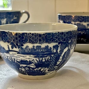 Vintage Japanese cobalt blue and white eggshell porcelain cups and saucers, set of 4 cups and 4 saucers. Rare find .