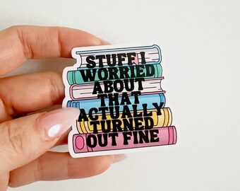 May include: A sticker with a stack of colorful books that says "Stuff I worried about that actually turned out fine."