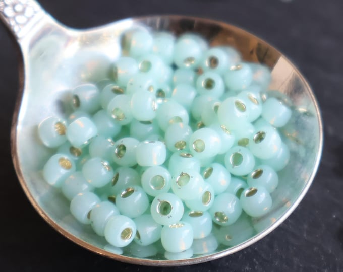 100 TOHO Seed Beads 6/0 Silver Lined Milky Light Peridot