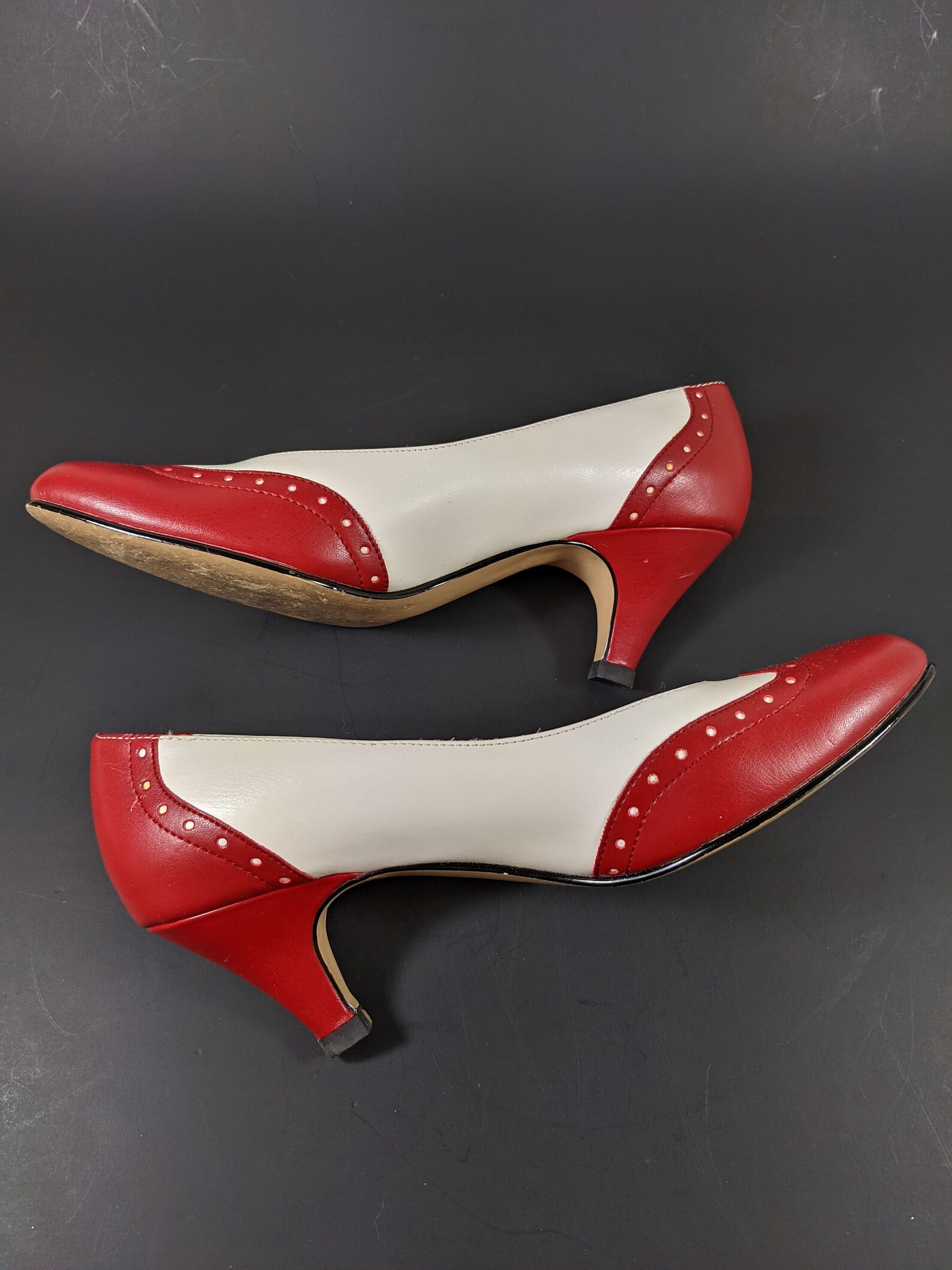 red and white spectator pumps