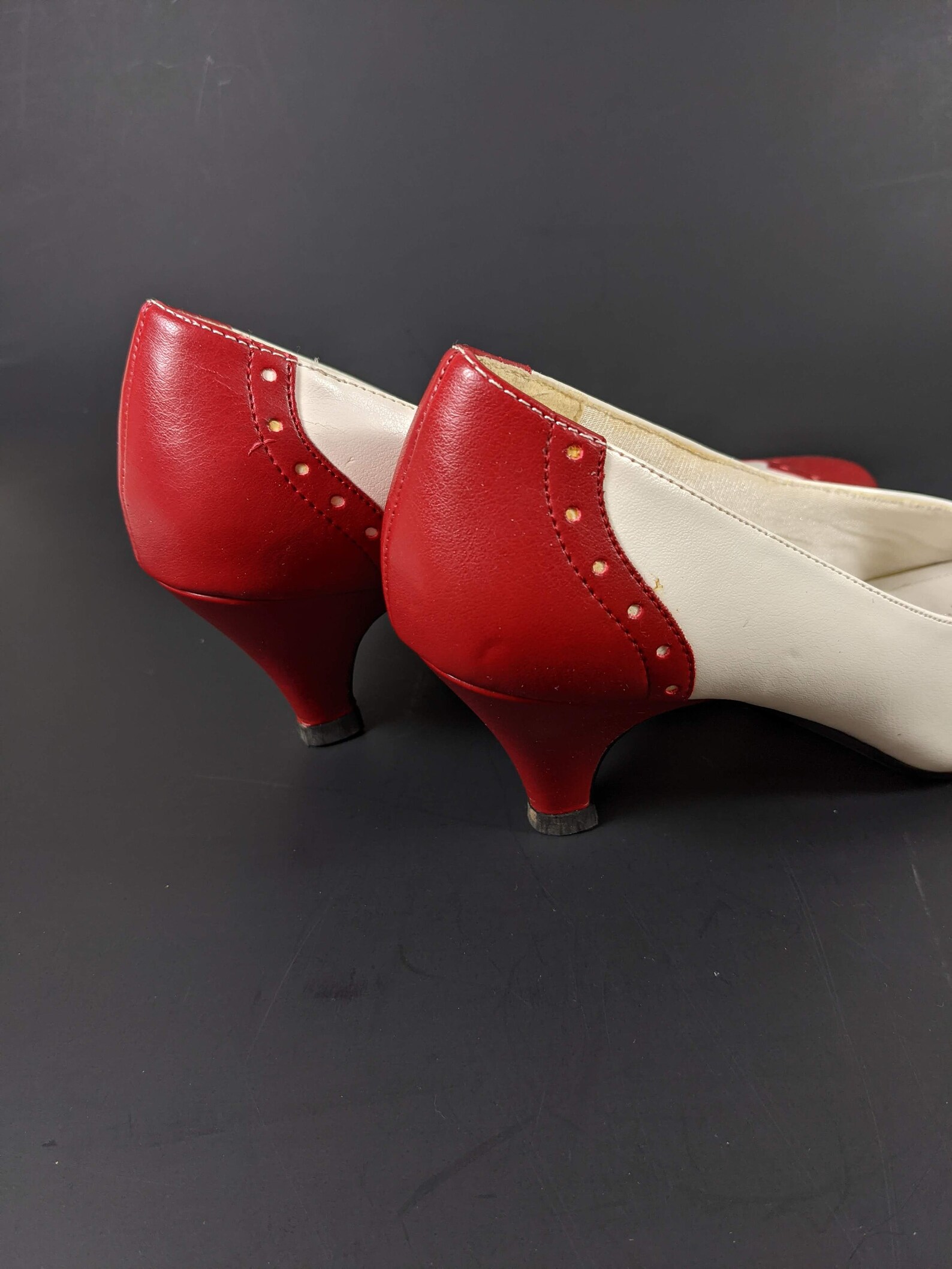 red and white spectator pumps