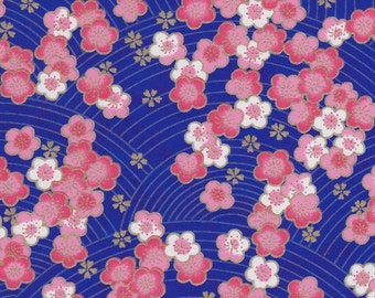 Chiyogami or yuzen paper - pink and white cherry blossoms on an ultramarine blue background with gold plum blossom accents, 9x12 inches