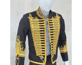May include: A black jacket with gold braid trim and buttons. The jacket has a stand-up collar and long sleeves.