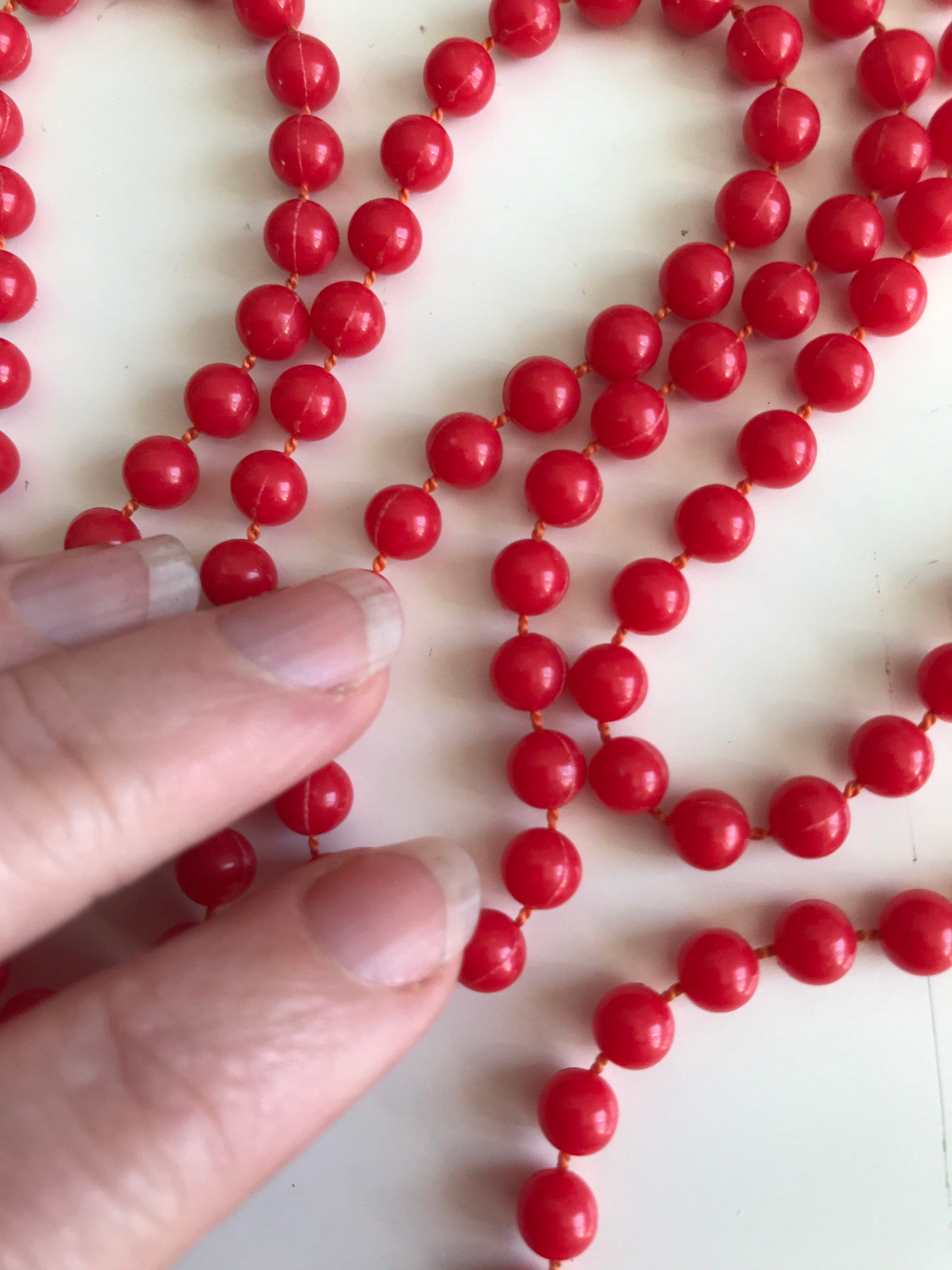 red plastic bead necklace