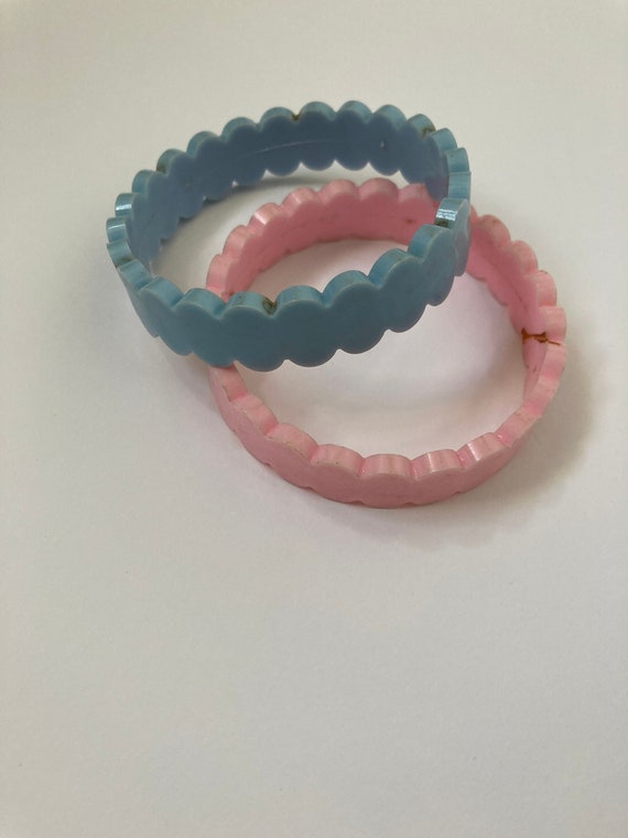 Pair of hard plastic bangles in pale blue and bab… - image 1