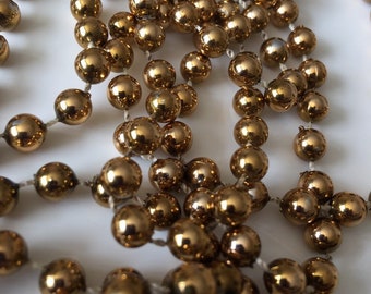 Vintage necklace - dark yellow gold self strung plastic beads - Costume Jewelry