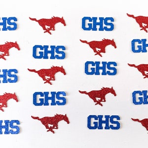 May include: A set of three ceramic mugs with a speckled, matte finish. The mugs are in shades of cream, light gray, and dark gray. Each mug has a simple, minimalist design, perfect for coffee or tea.