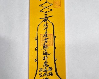 May include: A yellow paper scroll with black calligraphy. The text reads "大開運", "春", "福", "道", "神", "龍", "寿", "福", "開", "運", "大" and "開運".