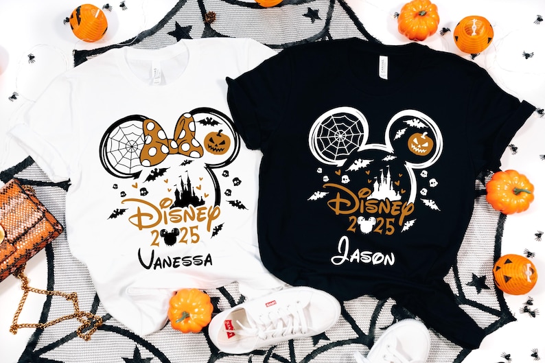 May include: Two Halloween t-shirts, one white and one black, with a Disney-themed design. The design includes Mickey Mouse ears with a spiderweb, pumpkin, castle, bats, and the text "Disney 2025" with a name. The white shirt has a polka-dot bow.