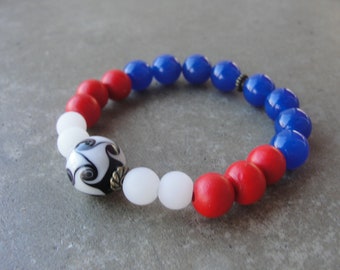 USA Soccer Team Fan Bracelet. Handmade Lampwork Soccer Ball Bead. Soccer Mom Beaded Stretch Bracelet. Red White Blue Beaded Jewelry.