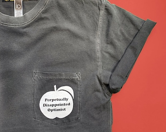 Perpetually Disappointed Optimist pocket tee - Unisex