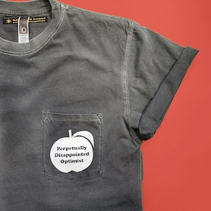 Perpetually Disappointed Optimist pocket tee - Unisex