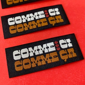 Comme ci Comme ca- Woven iron-on patch