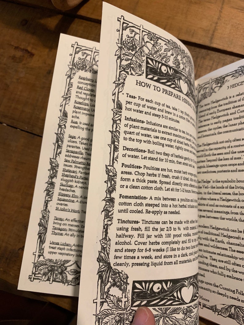 May include: A close-up of a book page with black and white illustrations of plants and herbs. The page features a section titled "How to Prepare Herbal Teas" and includes instructions for making teas, infusions, decoctions, poultices, fomentations, and tinctures. The text also mentions the use of herbs for various ailments and conditions.