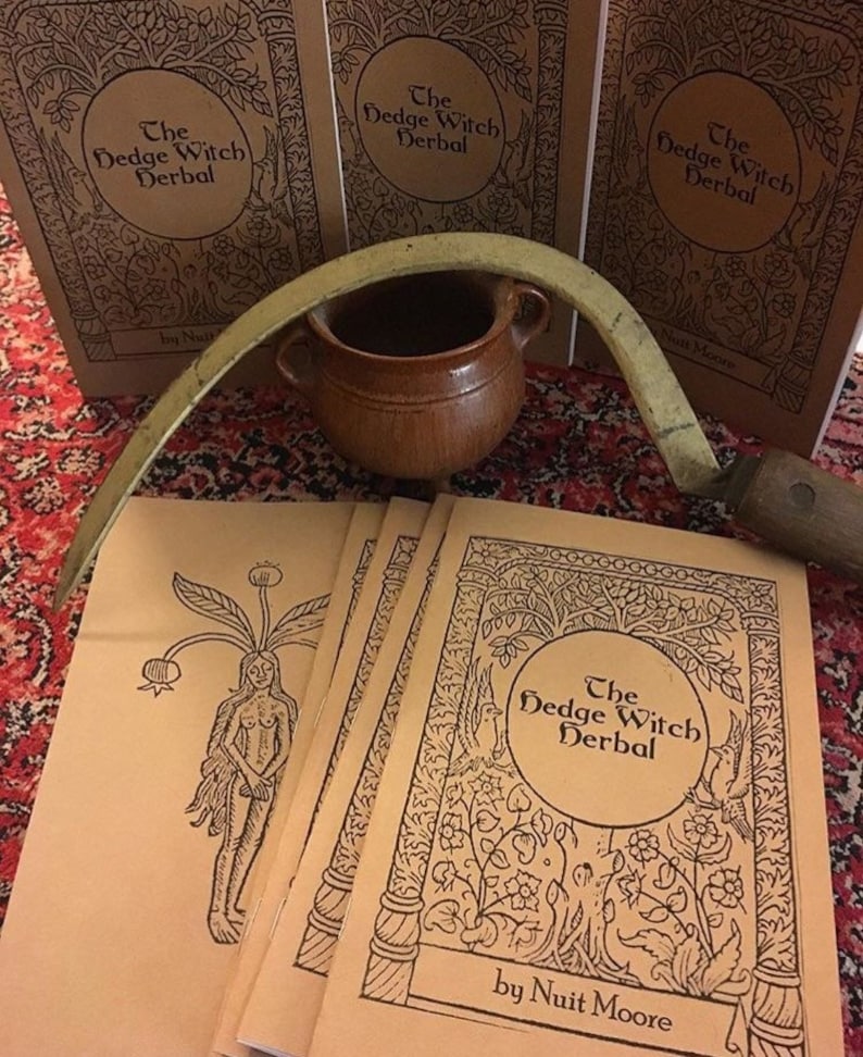 May include: A stack of five brown paperbacks with black ink illustrations and text. The book covers feature a stylized illustration of a tree with birds and flowers. The title of the book is "The Hedge Witch Herbal" by Nuit Moore.