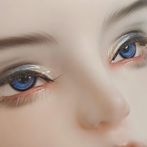May include: A close-up view of a doll face featuring bright blue eyes with detailed irises, long dark eyelashes, and subtle grey eyeshadow. The skin has a smooth, matte finish, and the eyebrows are finely painted with soft, natural-looking strokes.