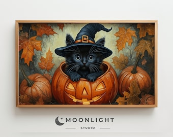 May include: A framed print featuring a black cat wearing a witch hat, nestled inside a carved orange pumpkin. The artwork has a Halloween theme, surrounded by autumn leaves and pumpkins. The print has the text "MOONLIGHT STUDIO".