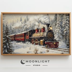 May include: A framed print of a vintage train in a snowy forest. The train is black, gold, and red, with a bright headlight. The artwork is set in a winter landscape with snow-covered trees and a cloudy sky. The frame is made of light-colored wood.