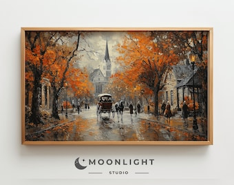 May include: A painting of a street scene in a small town with a church in the background. The trees are in autumn colors, and there is a horse-drawn carriage in the street. The painting is framed in a wooden frame.