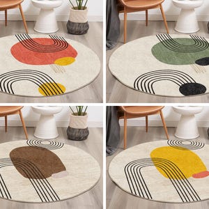 May include: Four round rugs with a cream background and black lines forming an arch shape. Each rug has a different colored shape in the center: red, green, brown, and yellow.