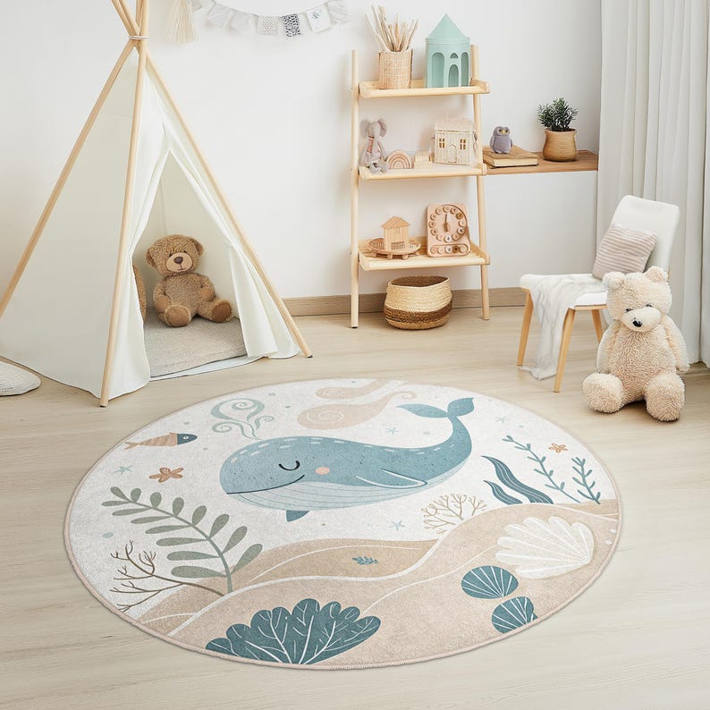Soft velvet-like nursery rug featuring a friendly whale, seaweed, and sandy ocean floor, made for safety and easy cleaning.