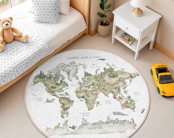 May include: A round children's rug featuring a world map design with continents and oceans in green and beige tones. The rug has the text "OLIVER'S WORLD MAP" and is placed in a child's bedroom.