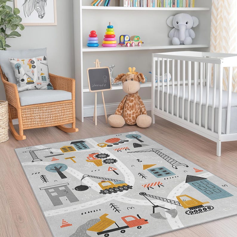 Colorful playroom carpet with bright yellow, blue, and orange construction equipment and cityscape details, creating a lively activity zone for kids