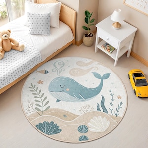 Ocean themed round rug with playful whale, fish, sea plants, and shells, designed for toddler rooms and baby nurseries.