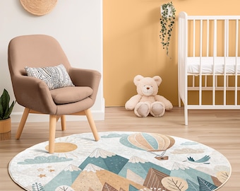 May include: A round, cream-colored rug with a whimsical design featuring mountains, a hot air balloon, and a bird. The rug has a light blue, brown, and green color scheme.